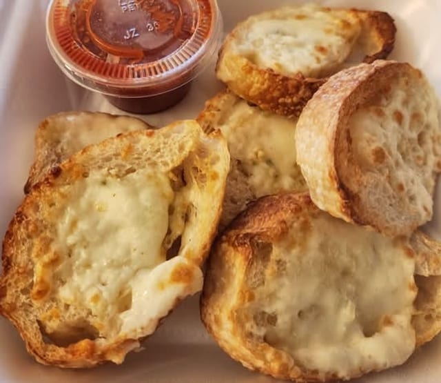 HALF TRAY GARLIC CHEESE BREAD.